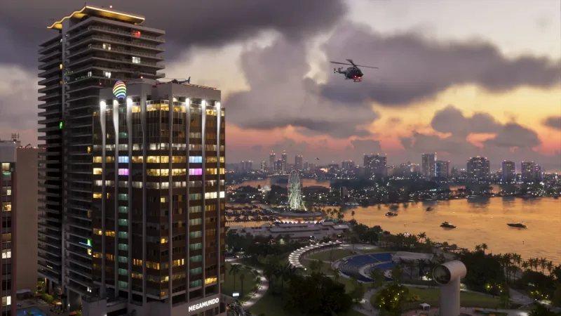 Schwere Wolken über der Bucht von Vice City in der Abenddämmerung, links das Megamundo-Hochhaus. Wie weit das Wetter über solche Stimmungen hinausgeht, soll die Titelgeschichte zeigen. Bild: Rockstar Games