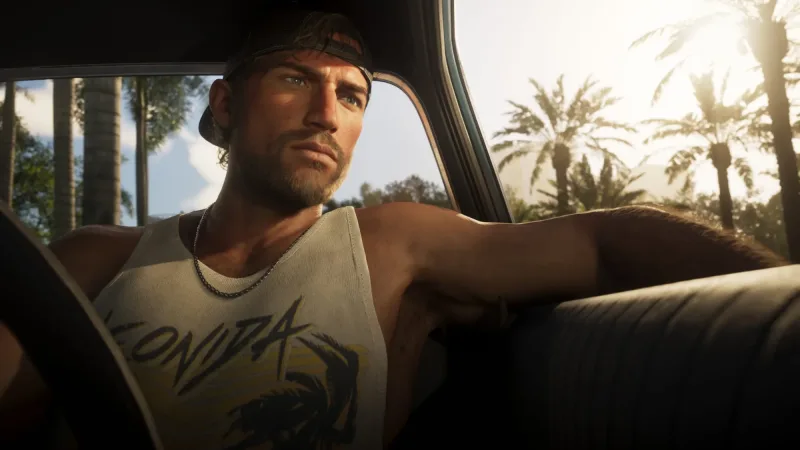 Jason im Wagen, im Rücken Palmen. Bild: Rockstar Games