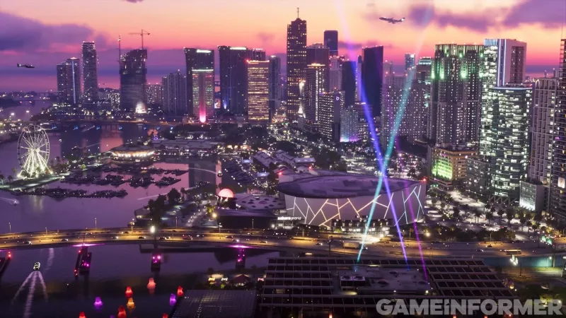 Vice City am Abend: in der Mitte die Sahara Arena, links ein Riesenrad, im Wasser vorn leuchten bärenförmige Schwimmkörper. Bild: Rockstar Games, Game Informer
