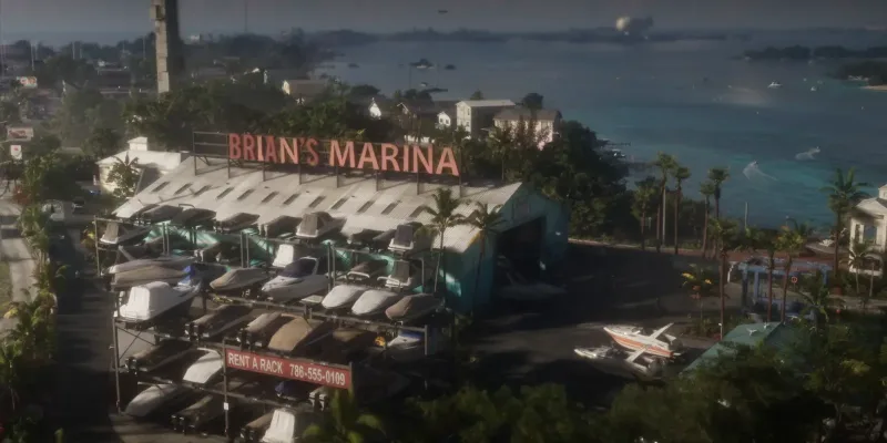Brian's Marina in den Keys von oben, mit Bootsregal und dem Schild Rent a Rack. Bild: Rockstar Games, Launch Trailer